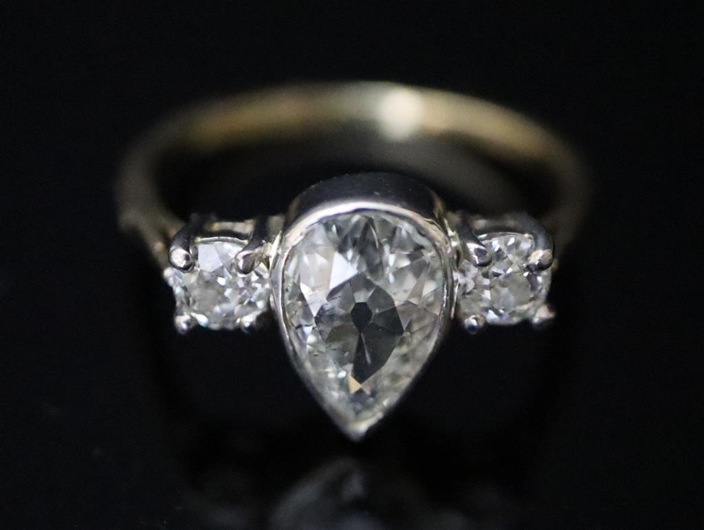 A gold and three stone diamond ring,